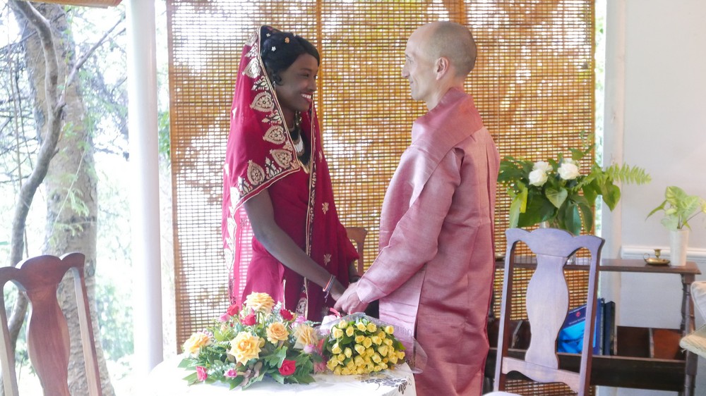 Francis and Rejoice holding hands