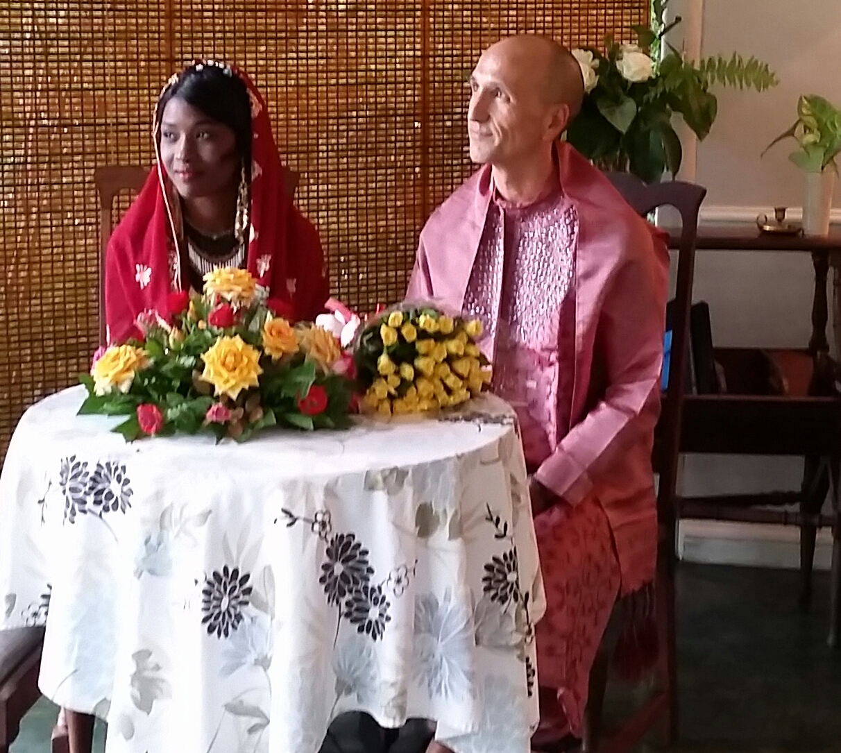 Francis and Rejoice listening to Andrew, the man who was marrying them