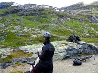 Maiu takes a break on the Rallarvegen to admire the cascades of fresh, glacier water Maiu takes a break on the Rallarvegen to admire the cascades of fresh, glacier water